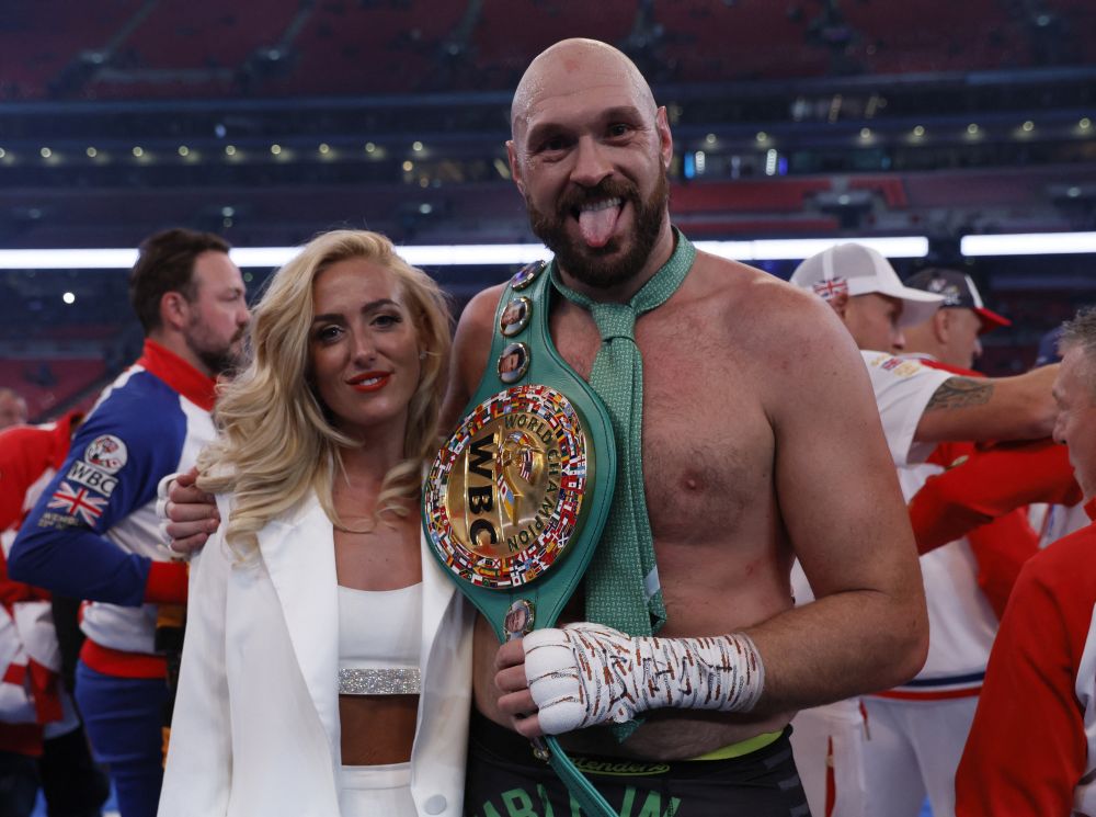 Tyson Fury celebrates with his wife Paris Fury and the WBC World Heavyweight Title belt after winning his fight against Dillian Whyte at Wembley Stadium, London April 23, 2022. u00e2u20acu201d Reuters pic