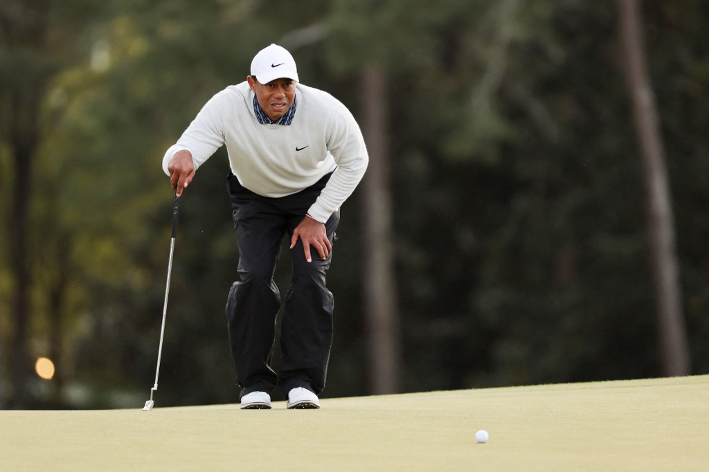 Tiger Woods lines up a putt on the 18th green during the third round of the Masters at Augusta National Golf Club on April 09, 2022 in Augusta, Georgia. u00e2u20acu201d  Getty Images via AFP