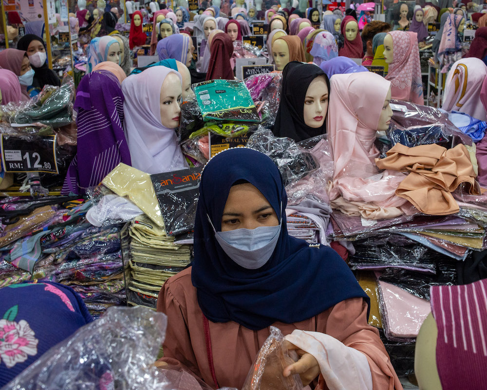 People shopping in Kuala Lumpur after Covid-19 SOPs were relaxed starting today, May 1, 2022. u00e2u20acu201d Picture by Shafwan Zaidon