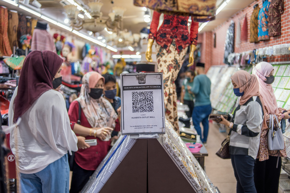 Malaysians no longer need to scan the MySejahtera contact tracing app to enter premises starting May 1. u00e2u20acu201d Picture by Shafwan Zaidon