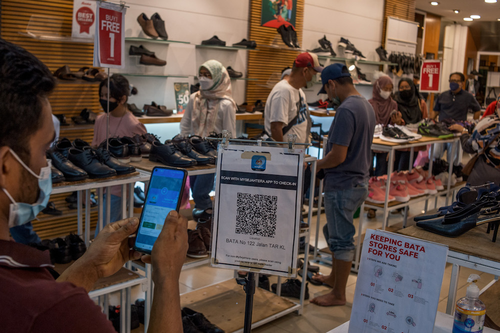Malaysians no longer need to scan the MySejahtera contact tracing app to enter premises starting May 1. u00e2u20acu201d Picture by Shafwan Zaidon