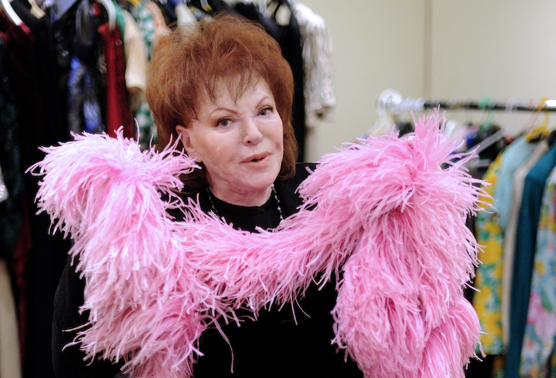 In this file photo taken on January 9, 2012 Paris night celebrity, singer, actress and businesswoman Regine poses with a long Ted Lapidus skirt drawn by Erte with the famous u00e2u20acu02dcboa at the Tajan galery in Paris. u00e2u20acu201d AFP pic