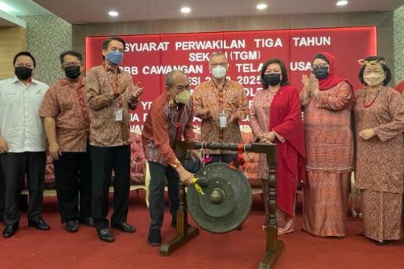 Gerald hits the gong to launch the PBB Telang Usan triennial delegates meeting in Miri today. u00e2u20acu201d Borneo Post pic