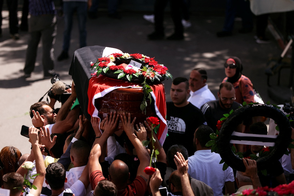 Family and friends of Al Jazeera reporter Shireen Abu Akleh, who was killed during an Israeli raid in Jenin in the occupied West Bank, carry her body as she arrives in Jerusalem May 12, 2022. u00e2u20acu201d Reuters pic