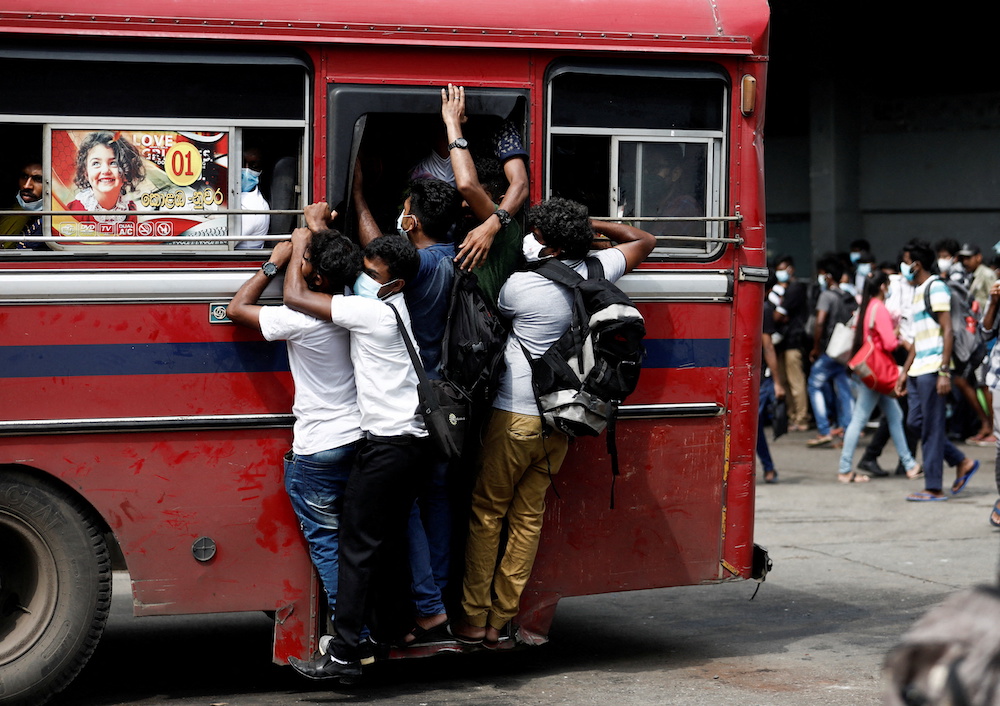 An over crowded bus leaves the main bus stand before curfew starts, after a clash between anti-government demonstrators and Sri Lanka's ruling party supporters, amid the country's economic crisis, in Colombo, Sri Lanka May 12, 2022. u00e2u20acu201d Reuters pic