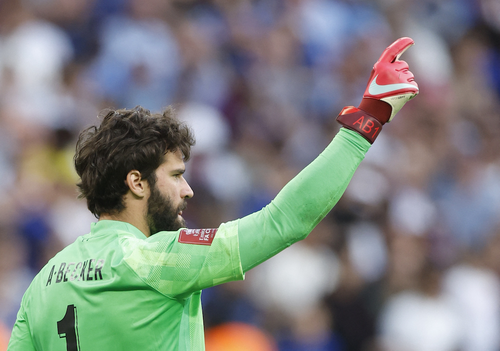 Liverpool's Alisson reacts after saving Chelsea's Mason Mount penalty during the shoot-out of the final of the FA Cup, London May 15, 2022. u00e2u20acu201d Action Images via Reuters/Peter Cziborra