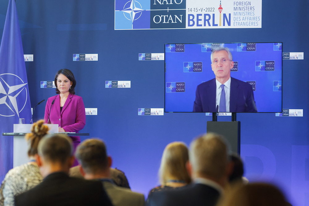German Foreign Minister Annalena Baerbock, stands next to Nato Secretary General, Jens Stoltenberg, seen on a screen speaking during a news conference at a Nato meeting in Berlin May 15, 2022. u00e2u20acu201d Reuters pic