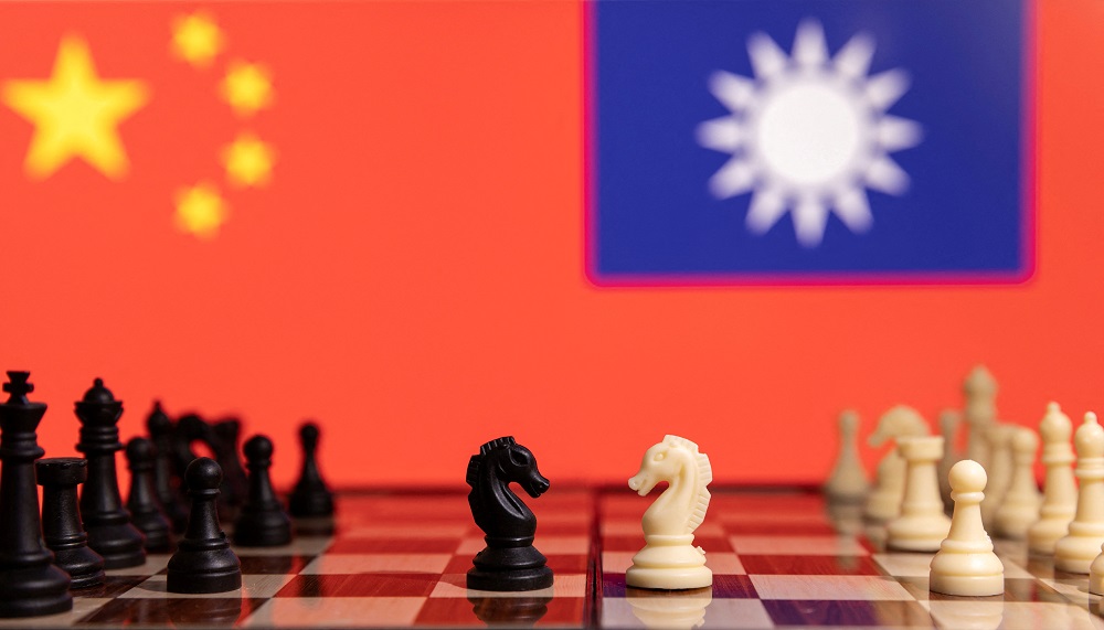 Chess pieces are seen in front of displayed China and Taiwanu00e2u20acu2122s flags in this illustration taken January 25, 2022.  u00e2u20acu201d Reuters pic