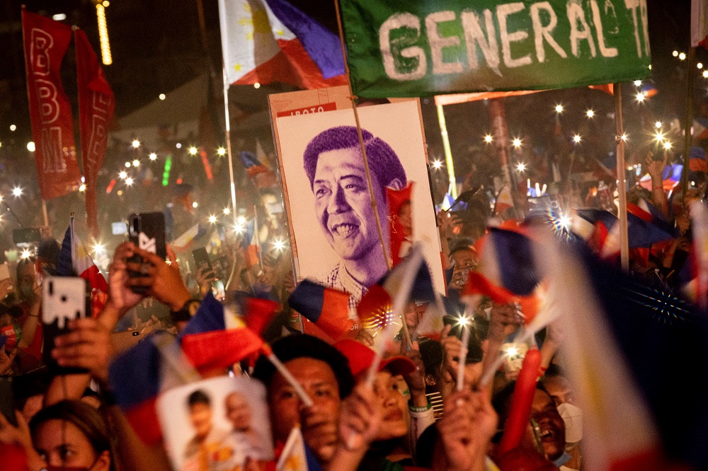 A portrait of Ferdinand u00e2u20acu02dcBongbongu00e2u20acu2122 Marcos Jr. is seen among the crowd of supporters during the presidential candidateu00e2u20acu2122s final campaign rally in Paranaque City, Metro Manila May 7, 2022. u00e2u20acu201d Reuters