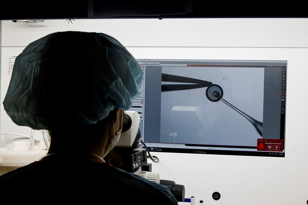 An employee demonstrates the work process before freezing eggs in a Fertility Research lab at Cha Fertility Centre in Bundang, South Korea April 30, 2022. — Reuters pic