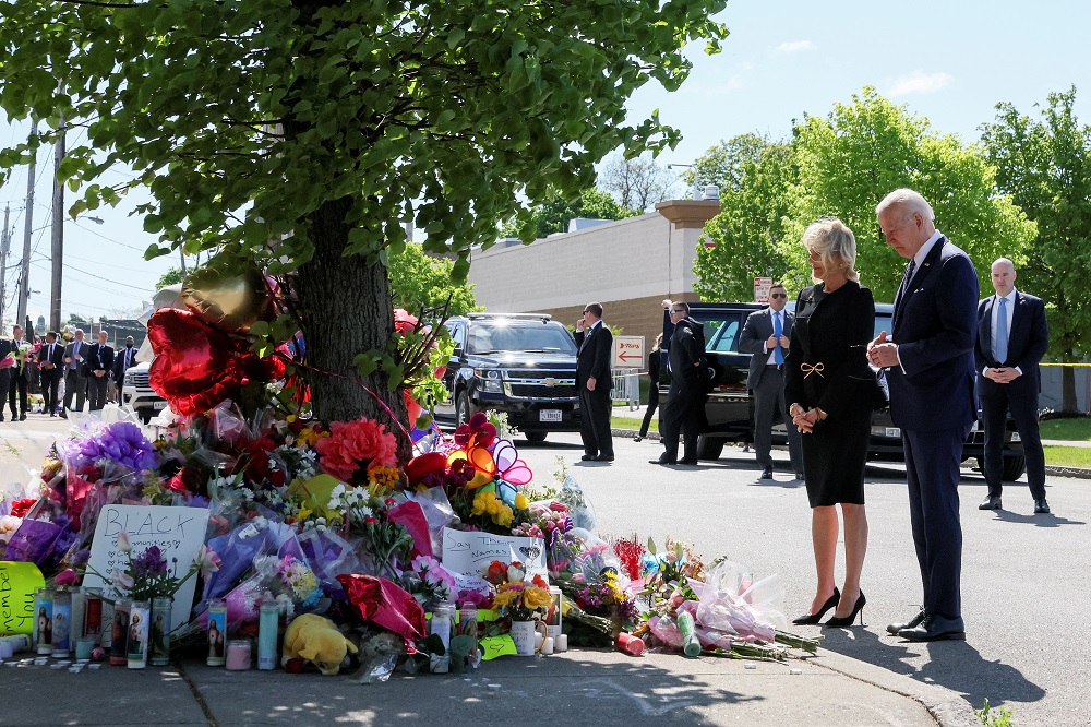 US President Joe Biden and first lady Jill Biden pay their respects to the 10 people killed in a mass shooting by a gunman authorities say was motivated by racism, at the TOPS Friendly Markets memorial site in Buffalo May 17, 2022. u00e2u20acu201d Reuters pic