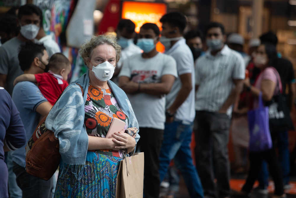People wearing protective masks are pictured at Bukit Bintang May 1, 2022. — Picture by Devan Manuel 