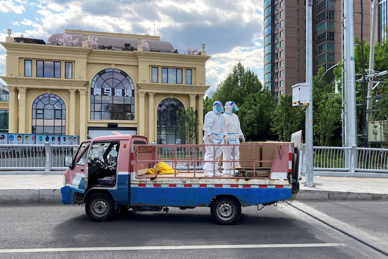 Workers in protective suits stand in a truck on a street amid the coronavirus disease (Covid-19) outbreak, during the Labour Day holiday, in Chaoyang district of Beijing, China May 1, 2022. u00e2u20acu201d Reuters pic 