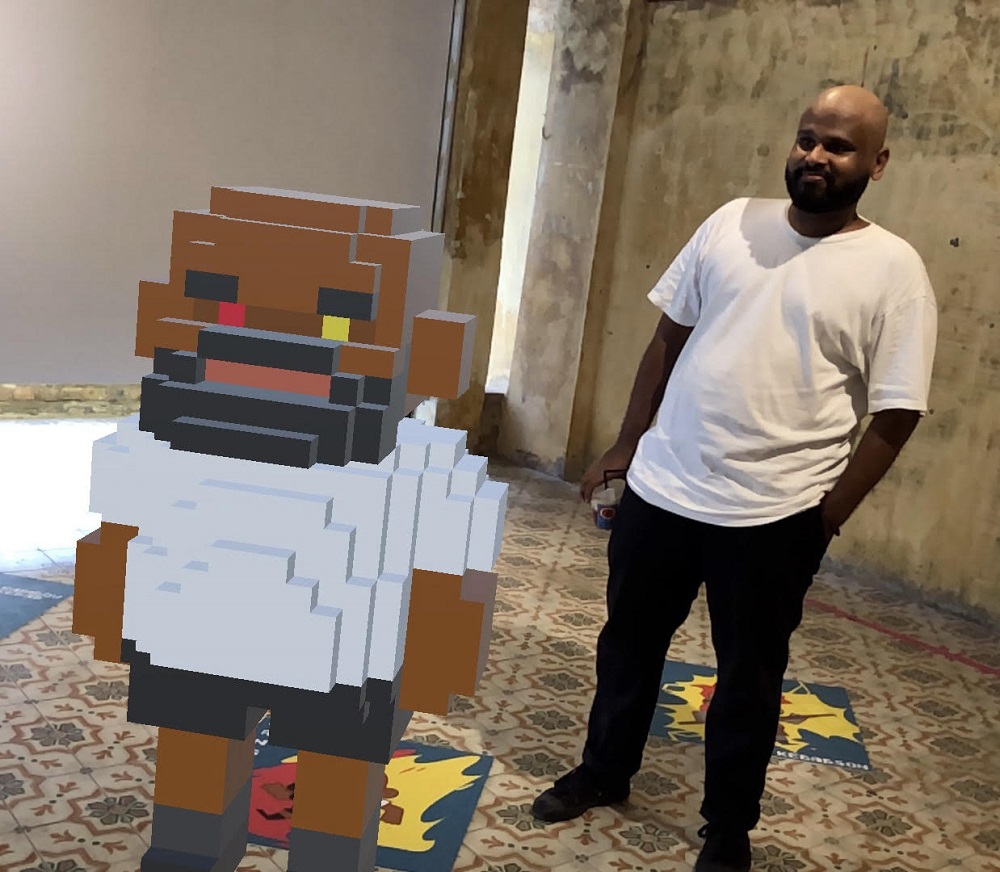 Kangblabla with his AR toy at the exhibition. 