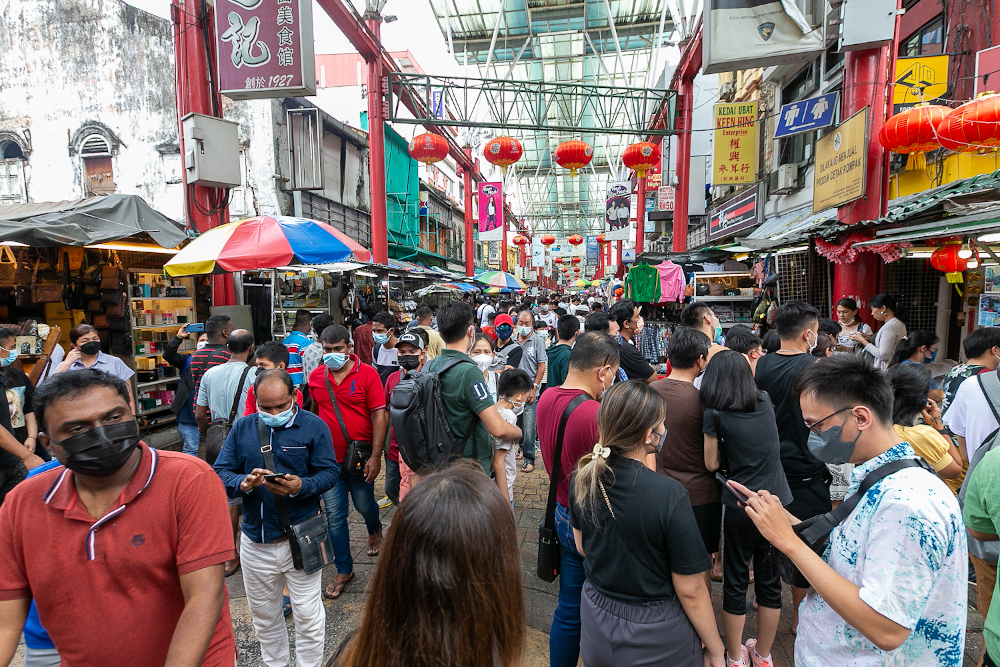 Locals and foreigners throng Petaling Street May 3, 2022. — Picture by Devan Manuel