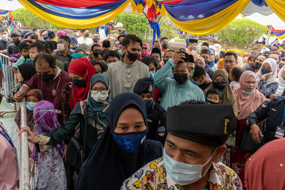 People attend the Raya Aidilfitri Open House at Seri Perdana, Putrajaya on May 8, 2022. — Picture by Shafwan Zaidon