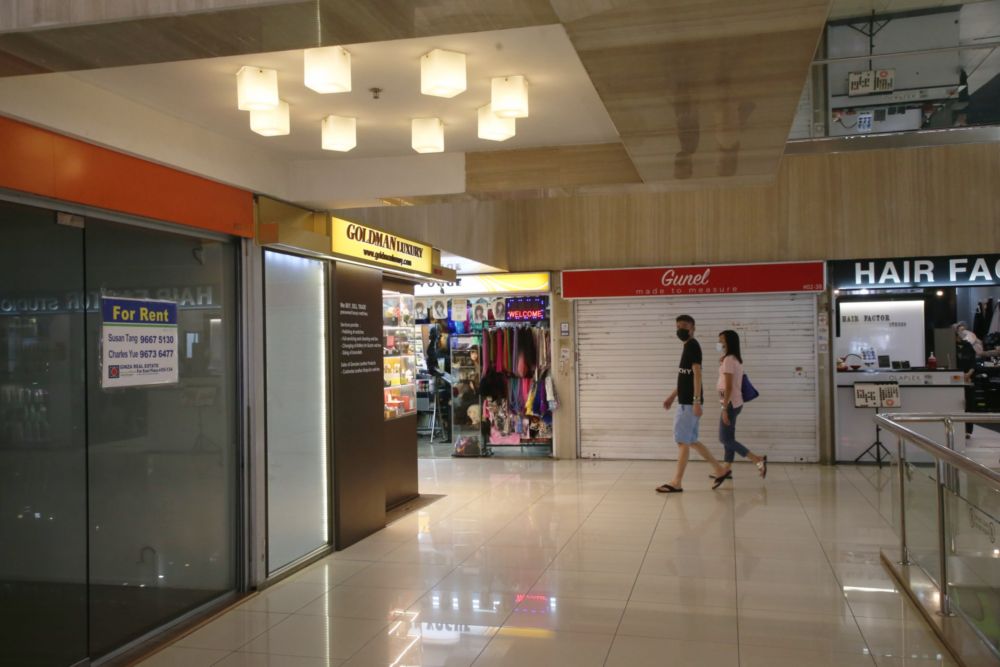 People walking by some shops in Far East Plaza mall in the Orchard Road shopping belt. — TODAY pic