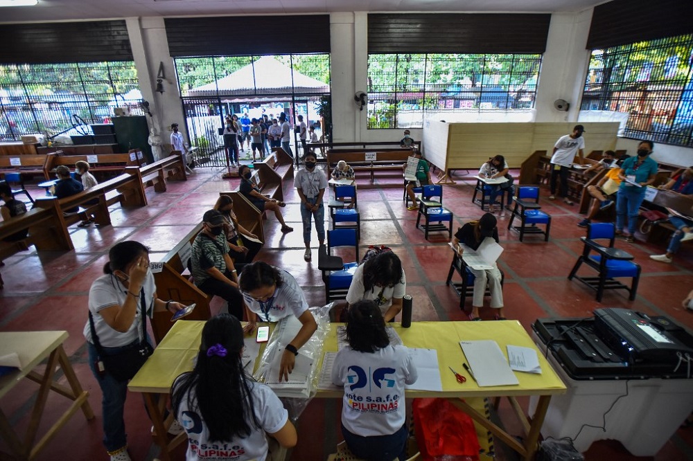People cast their votes at a chapel which has been converted into a voting precinct during the presidential election in Quezon City, suburban Manila May 9, 2022. u00e2u20acu201d AFP pic
