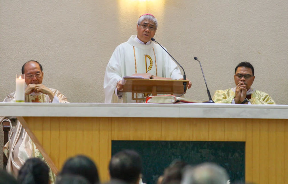 Archbishop William Goh (centre) addressing a congregation at Church of the Risen Christ in Toa Payoh in 2017. u00e2u20acu201d Picture via Facebook/Catholic Life Singapore