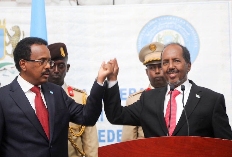 Hassan Sheikh Mohamud(right), Somalia's newly elected president with Mohamed Abdullahi Mohamed, the incumbent president in Mogadishu, Somalia. May 16, 2022. u00e2u20acu201d Reuters pic