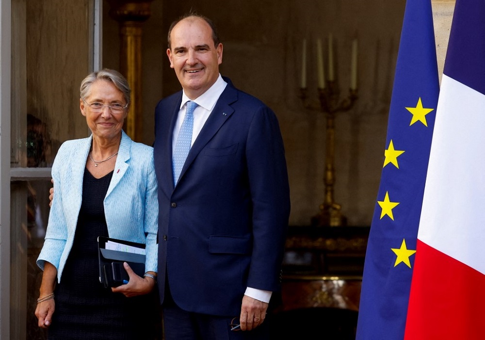 Franceu00e2u20acu2122s outgoing Prime Minister Jean Castex (right) and his successor, former Labour Minister Elisabeth Borne, attend a handover ceremony in Paris May 16, 2022. u00e2u20acu201d AFP pic 