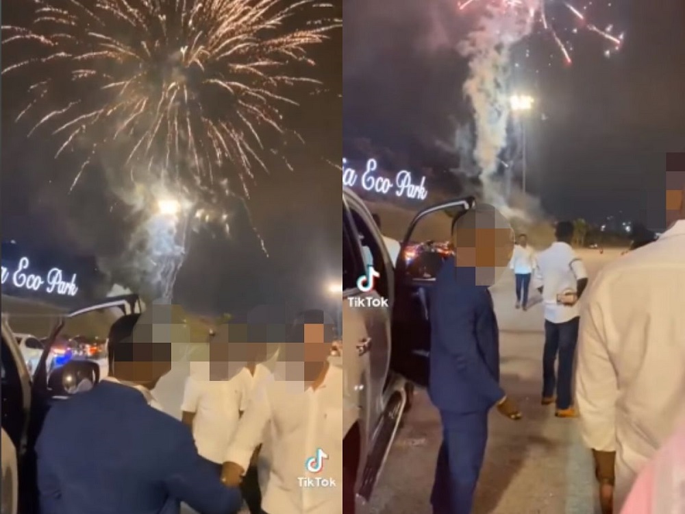 A group of sharply dressed men was seen burning fireworks by the roadside of Setia Alamu00e2u20acu2122s toll plaza. u00e2u20acu201d Screen capture via Facebook/ Traffic Info Crew