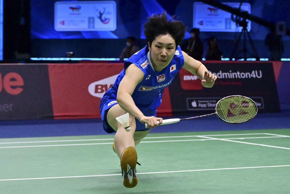 Japanu00e2u20acu2122s Akane Yamaguchi lunges for the shuttle against Germanyu00e2u20acu2122s Yvonne Li during the group stages of the Thomas and Uber Cup badminton tournament in Bangkok May 8, 2022. u00e2u20acu201d AFP pic