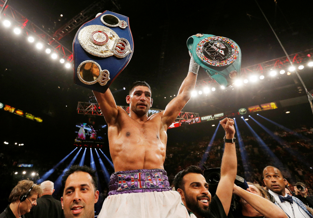 The 35-year-old British fighter, who became a unified world champion at light-welterweight, hangs up his gloves with a record of 34 wins from his 40 fights. u00e2u20acu201d Action Images via Reuters