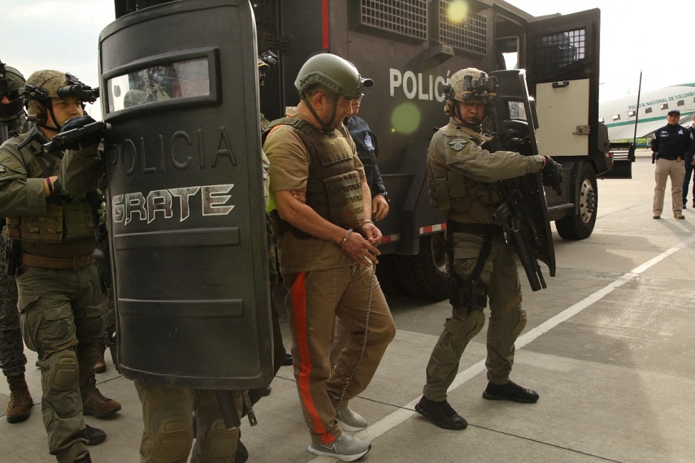 Colombian drug trafficker Dairo Antonio Usuga David, gets escorted by police officers after Colombia extradites him to the United States, in Bogota, Colombia May 4, 2022. u00e2u20acu2022 Colombia Policia Nacional (PONAL)/Handout via Reuters