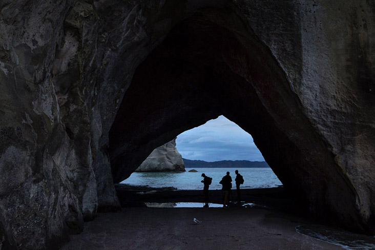 Silhouettes of other visitors to Cathedral Cove, waiting to catch the sunrise.