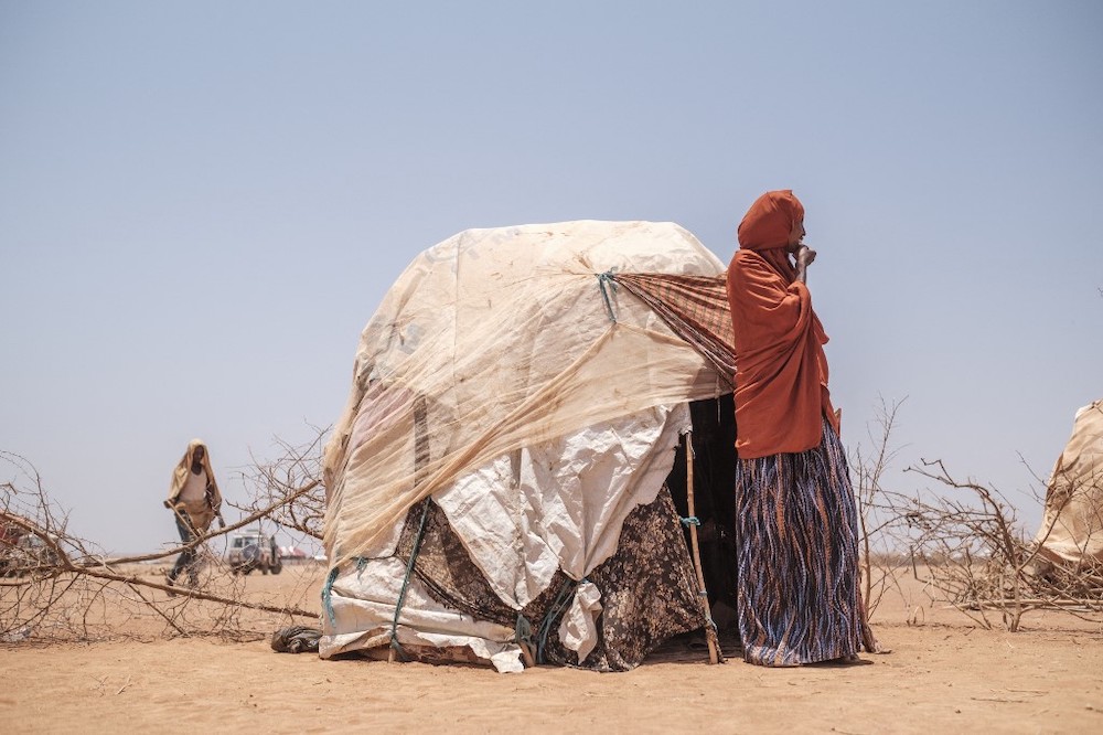 A woman stands next to a tent in the camp for internally displaced people of Farburo 2 in the village of Adlale, near the city of Gode, Ethiopia, on April 6, 2022. u00e2u20acu201d AFP picnn