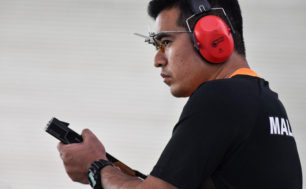 National shooter Hafiz Adzha in action during the 25 metre Menu00e2u20acu2122s Rapid Fire Pistol event at the Hanoi National Sports Training Centre in Hanoi, May 16, 2022. u00e2u20acu201d Bernama pic 