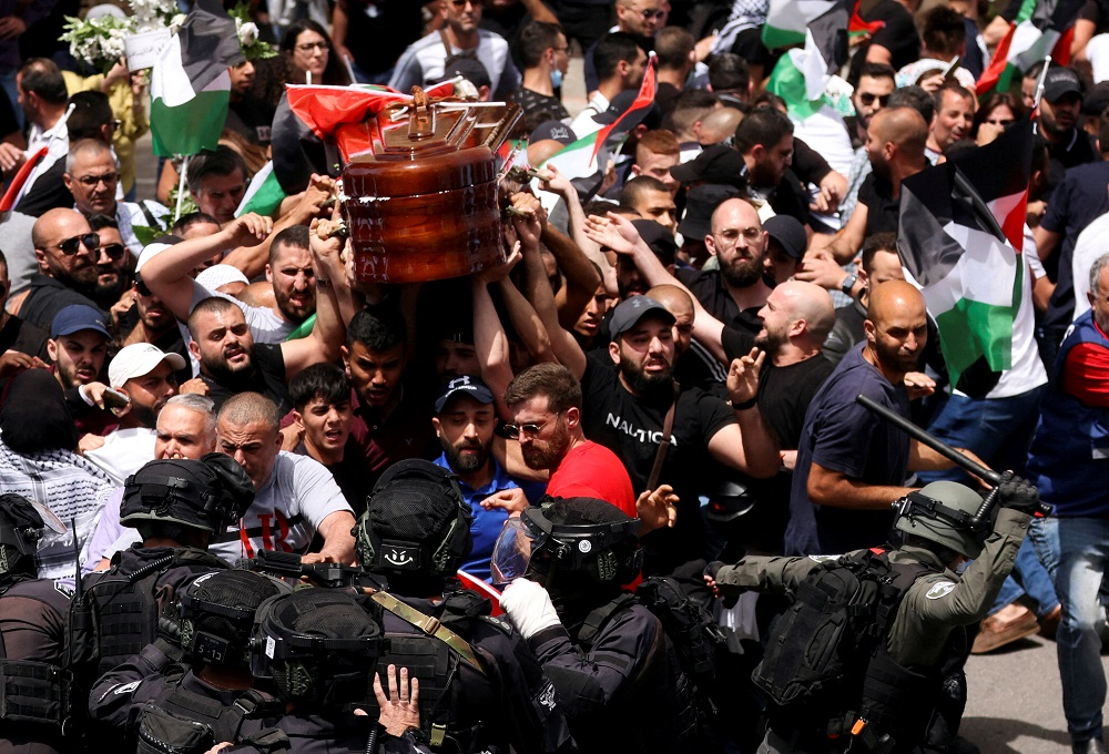 Family and friends carry the coffin of Al Jazeera reporter Shireen Abu Akleh, who was killed during an Israeli raid in Jenin in the occupied West Bank, during her funeral in Jerusalem, May 13, 2022. u00e2u20acu2022 Reuters pic