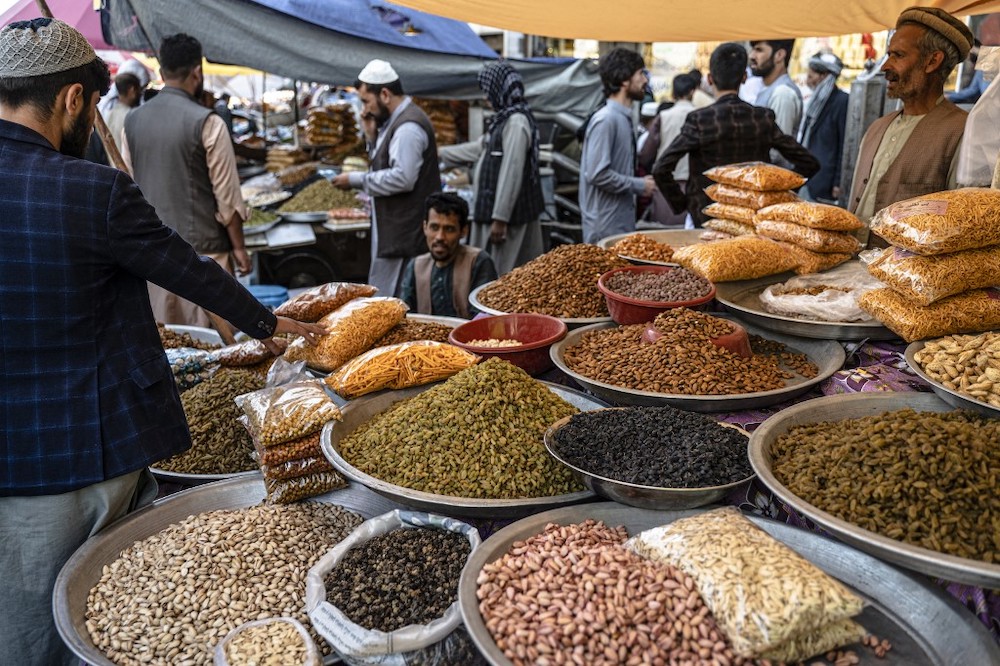 People buy dry fruits ahead of Eid al-Fitr which marks the end of the holy fasting month of Ramadan, at a market in Kabul on April 30, 2022. u00e2u20acu201d AFP pic