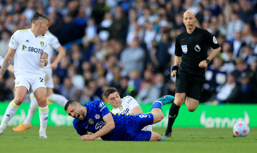 Leeds Unitedu00e2u20acu2122s Daniel James fouls Chelseau00e2u20acu2122s Mateo Kovacic and receives a red card during a match at Elland Road, Leeds, Britain, May 11, 2022. u00e2u20acu201d Action Images via Reuters