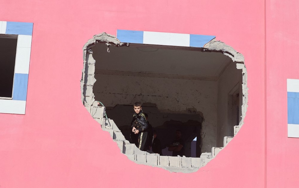 Palestinians inspect a house demolished by Israeli security forces in the village of Silat al-Harithiya, near the flashpoint town of Jenin in the occupied West Bank, early on May 7, 2022. u00e2u20acu201d AFP picnn