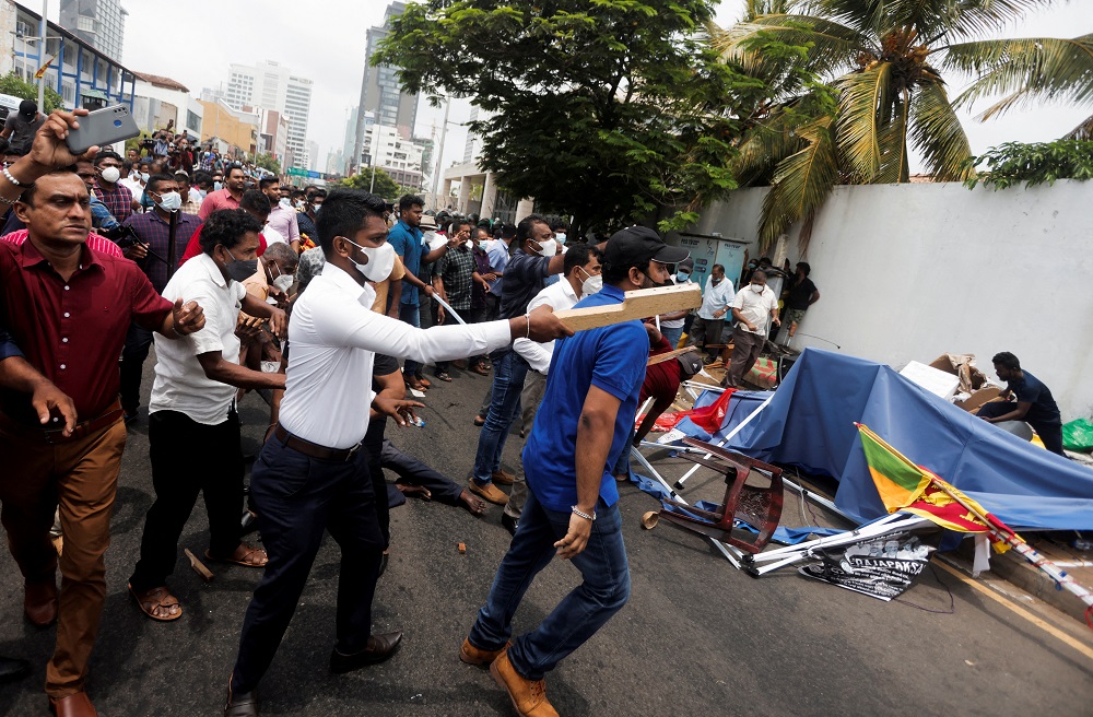 Supporters of Sri Lanka's ruling party destroy tents belonging to anti-government demonstrators in front of the Prime Minister's official residence in Colombo, Sri Lanka, May 9, 2022. u00e2u20acu2022 Reuters pic