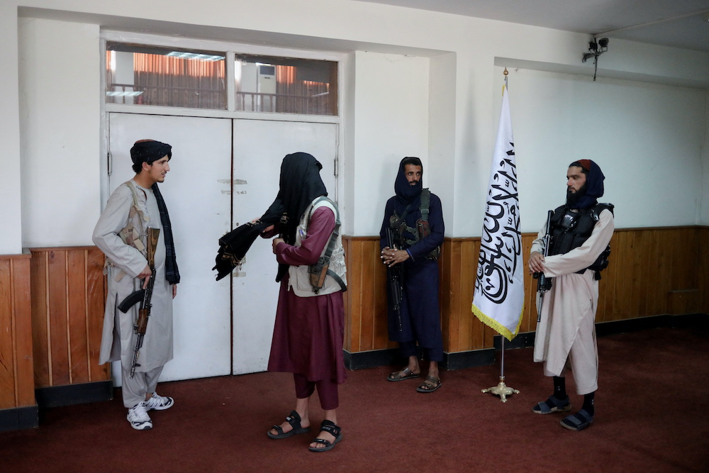 Taliban fighters stand guard at a news conference about a new command of hijab by Taliban leader Mullah Haibatullah Akhundzada, in Kabul, Afghanistan, May 7, 2022. u00e2u20acu201d Reuters pic