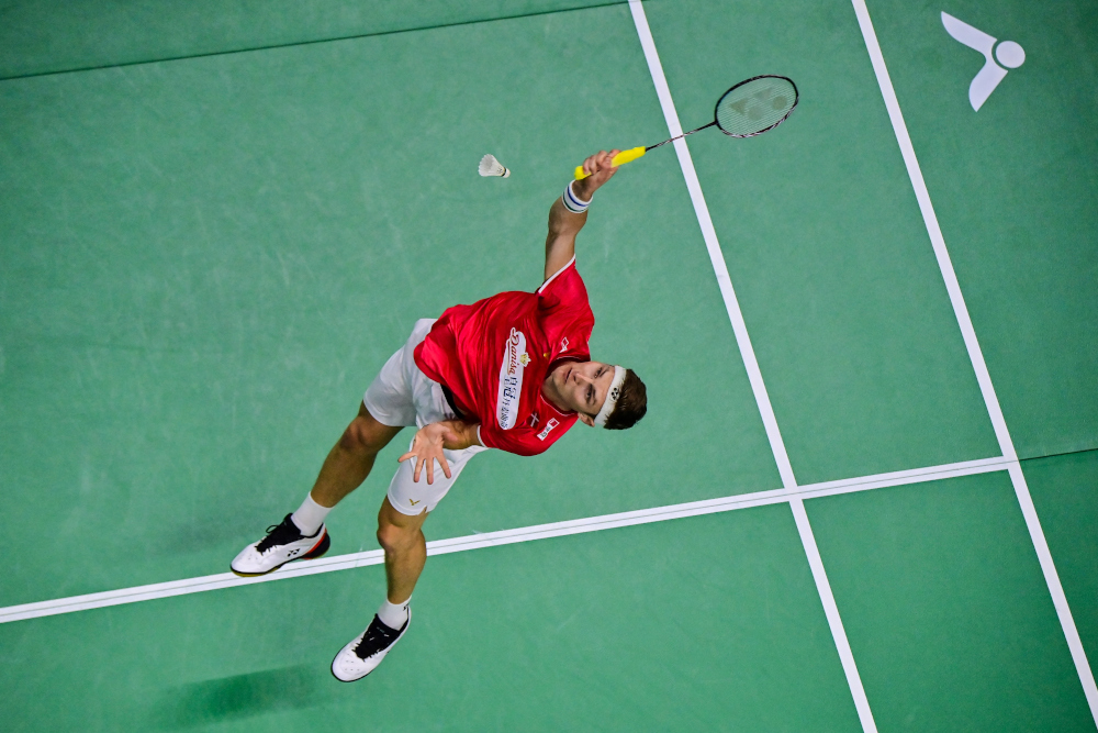 Denmarku00e2u20acu2122s Viktor Axelsen returns a shot against Franceu00e2u20acu2122s Toma Junior Popov during their menu00e2u20acu2122s singles group stage match at the 2022 Thomas and Uber Cup badminton tournament in Bangkok May 10, 2022. u00e2u20acu201d AFP pic 