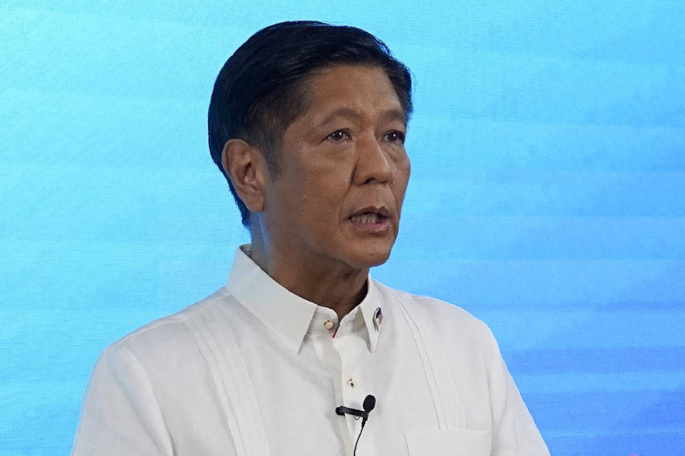 Presidential candidate Ferdinand Marcos Jr speaks to reporters at the campaign headquarters in Manila on May 11, 2022. u00e2u20acu201d AFP pic