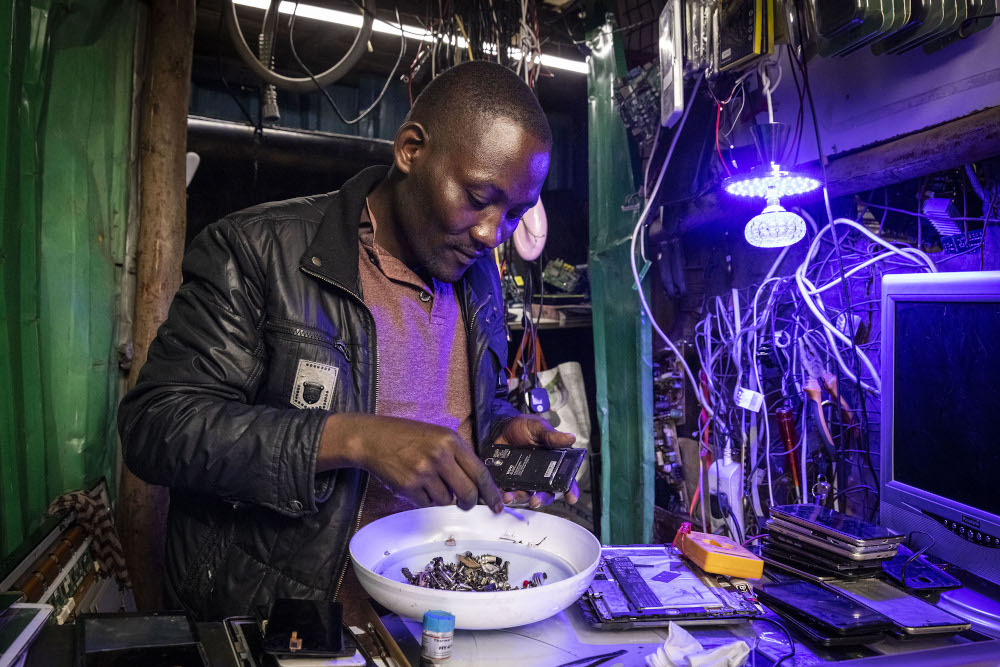 Japhlet Kamau, technician of the local NGO Electronic Waste Initiative Kenya (E-WIK). u00e2u20acu201d AFP pic