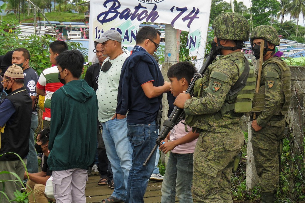 Military personnel stand guard outside a polling precinct during the Philippine presidential election in Marawi on the southern island of Mindanao on May 9, 2022. u00e2u20acu201d AFP pic