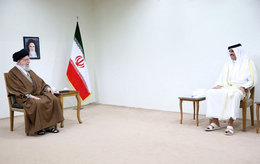 A handout picture provided by the office of Iran's Supreme Leader Ayatollah Ali Khamenei on May 12, 2022, shows him (left) meeting with Qatar's Emir Sheikh Tamim bin Hamad al-Thani in the capital Tehran. u00e2u20acu201d Khamenei.IR pic via AFP