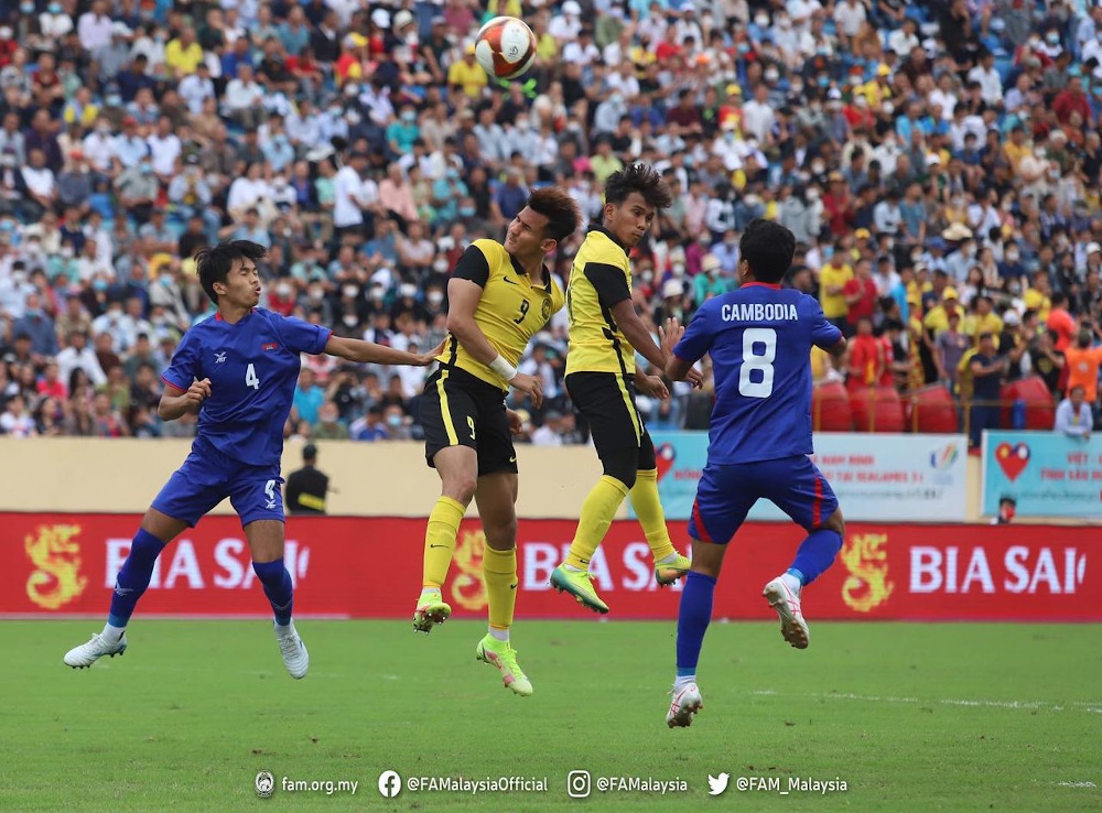 Malaysiau00e2u20acu2122s football players are seen in action against Cambodia at the 31st SEA Games menu00e2u20acu2122s football final Group B match at the Thien Truong Stadium in Nam Dinh May 16, 2022. u00e2u20acu201d Picture via Twitter/FA Malaysia