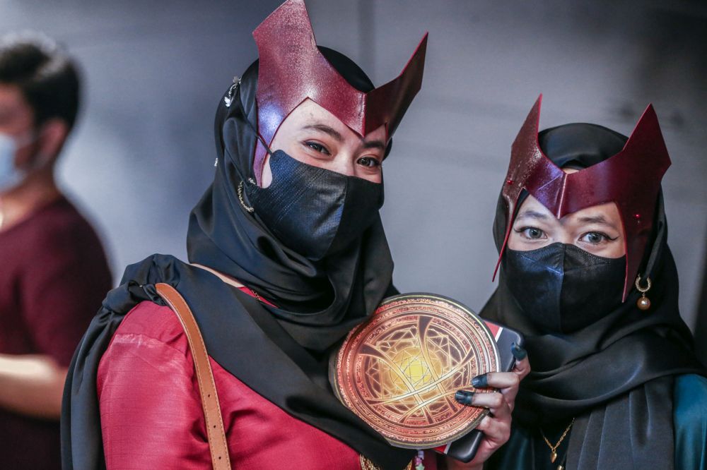 Long time magic fan Miharu (left) dressed up as Scarlet Witch specifically for ‘Doctor Strange in the Multiverse of Madness’ screening. — Picture by Hari Anggara