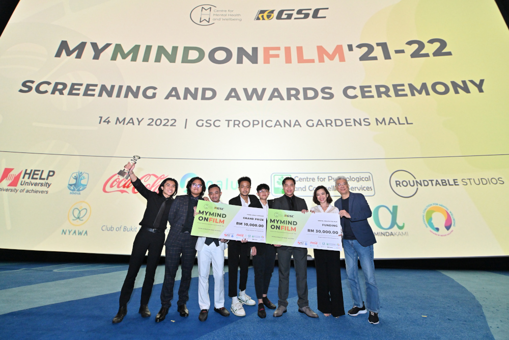 Grand prize winner for Young Adult Category (from left) Ahmad Shah and the u00e2u20acu02dcHalfway Downu00e2u20acu2122 team along with GSC CEO Koh Mei Lee and COO Tung Yow Kong. u00e2u20acu201d Picture courtesy of GSC