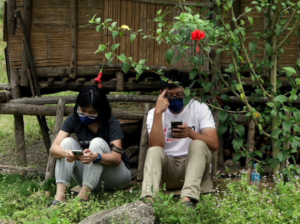 Relatives of the two women hikers who were swept away by a water surge while hiking at Gunung Suku around 5am yesterday, wait while search and rescue operations were carried out, May 16, 2022. u00e2u20acu201d Bernama pic 