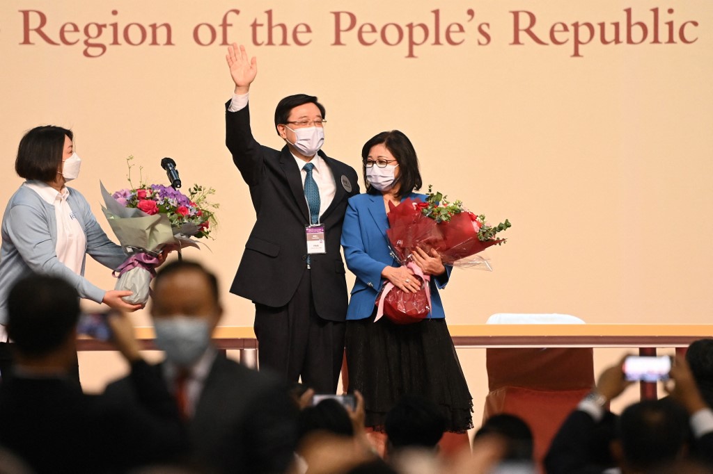 John Lee (centre) celebrates with his wife Janet (right) after he was named as the cityu00e2u20acu2122s new leader in Hong Kong on May 8, 2022. u00e2u20acu201d AFP pic