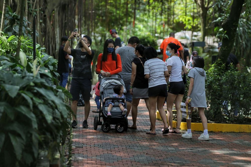 Visitors are pictured at the Kuala Lumpur Bird Park May 4, 2022. u00e2u20acu201d Picture by Ahmad Zamzahuri