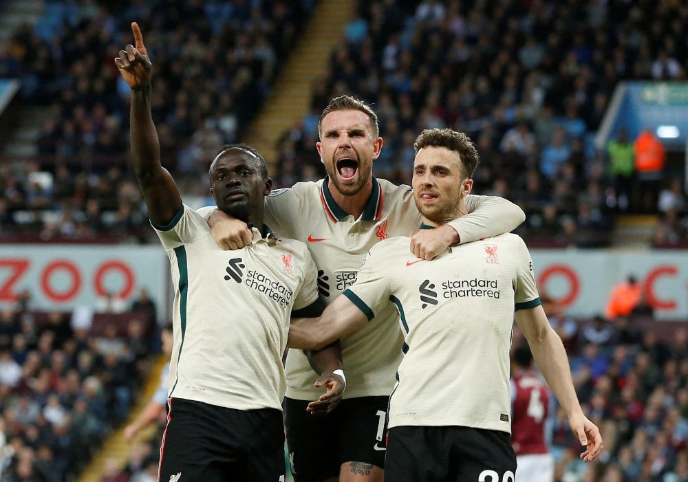 Liverpool's Sadio Mane (left) celebrates scoring their second goal against Aston Villa with Diogo Jota and Jordan Henderson at Villa Park, Birmingham May 10, 2022. u00e2u20acu201d Reuters pic